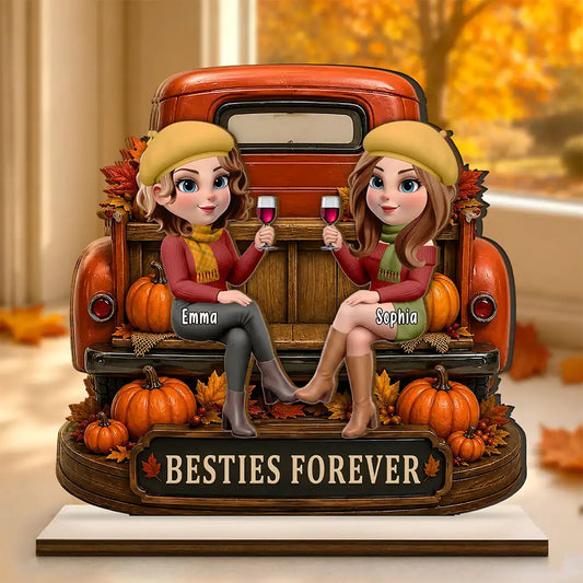 Personalized Besties Forever plaque with two friends on a red truck tailgate with pumpkins