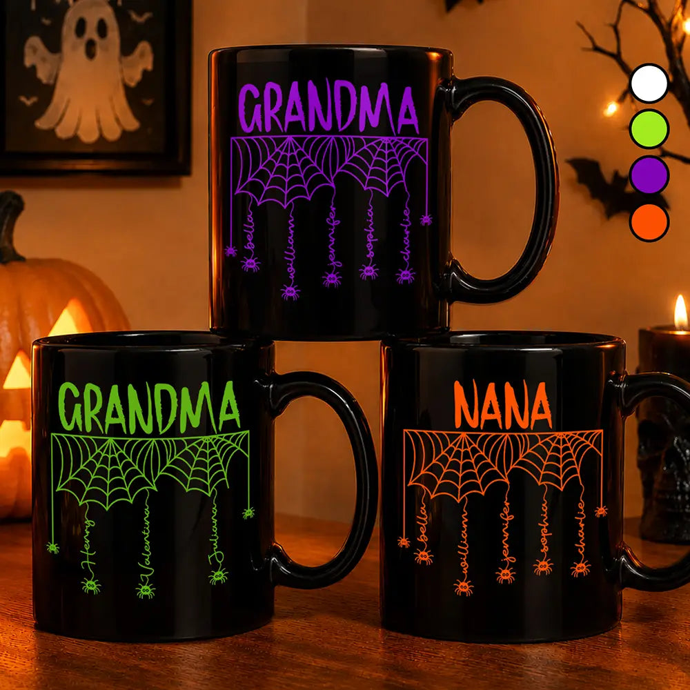 Three personalized Halloween mugs reading Grandma and Nana with spider webs and names
